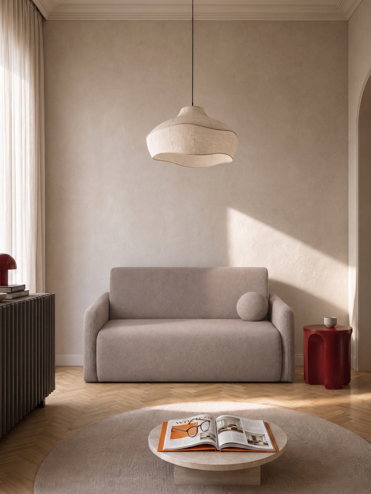 Sofa rozkładana Nido dwuosobowa 120 cm beżowa boucle z poduszką w aranżacji pokoju