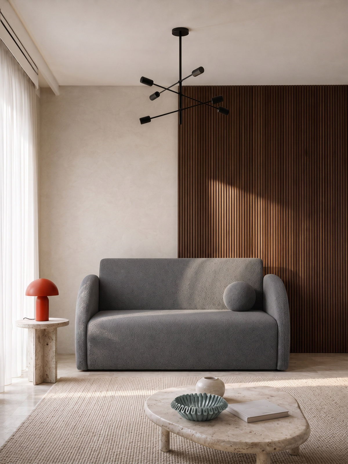 Sofa rozkładana Nubi trzyosobowa szara boucle z poduszką w nowoczesnym wnętrzu